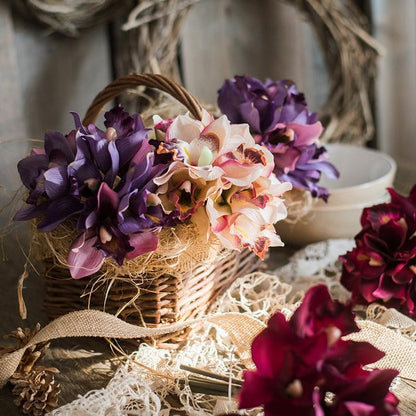 Artificial silk orchid bouquet cymbidium in purple and peach hues in a woven basket RusticReach on Tampa Home & Garden Store