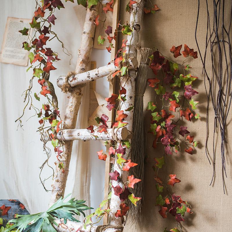 RusticReach artificial ivy vine 43in autumn colors draped over birch ladder on Tampa Home & Garden Store