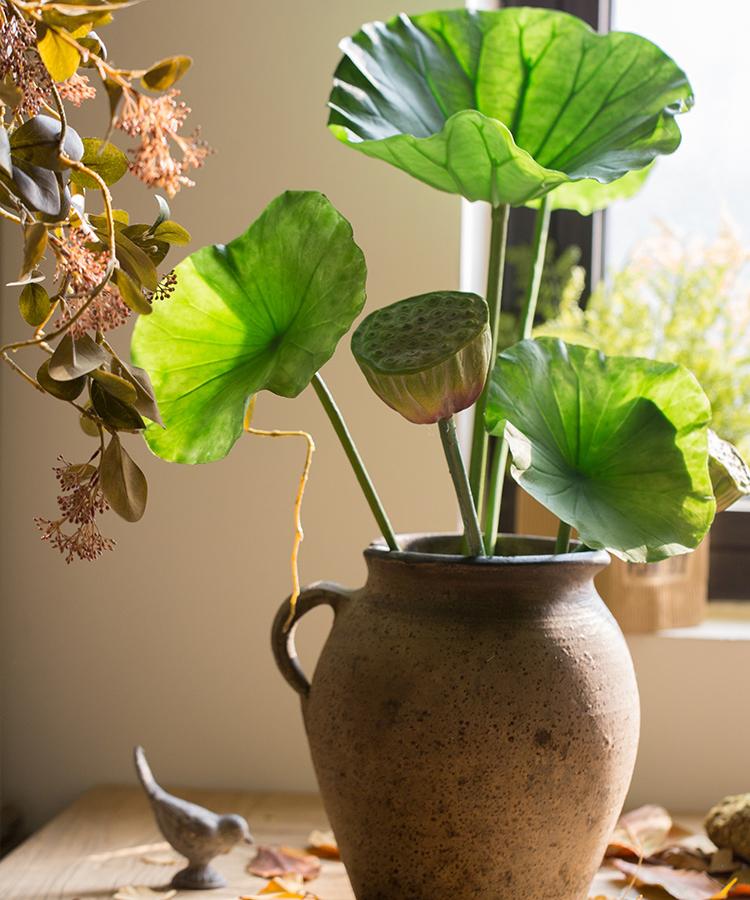 Artificial lotus seed and leaf stem in a rustic ceramic vase with green leaves RusticReach on Tampa Home & Garden Store