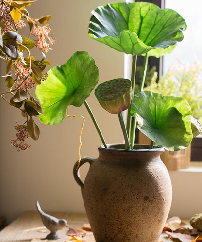 Artificial lotus seed and leaf stem in a rustic ceramic vase with green leaves RusticReach on Tampa Home & Garden Store