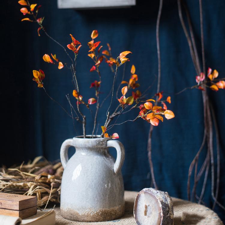 Artificial orange-red vine leaf stems RusticReach in a gray ceramic vase with handles on Tampa Home & Garden Store