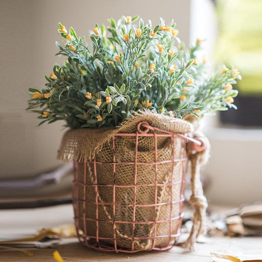 Silk orchid stem set in yellow, 13 tall, arranged in a pink wire basket with burlap wrap on Tampa Home & Garden Store