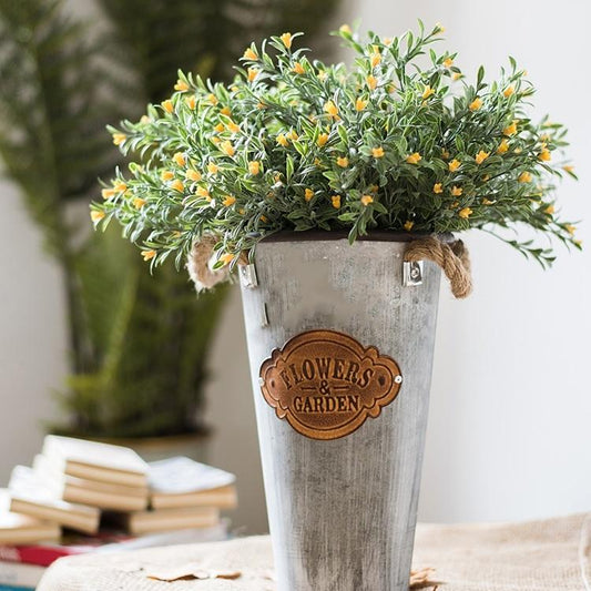 Silk orchid stem set in yellow, 13 inches tall in a rustic galvanized metal planter on Tampa Home & Garden Store
