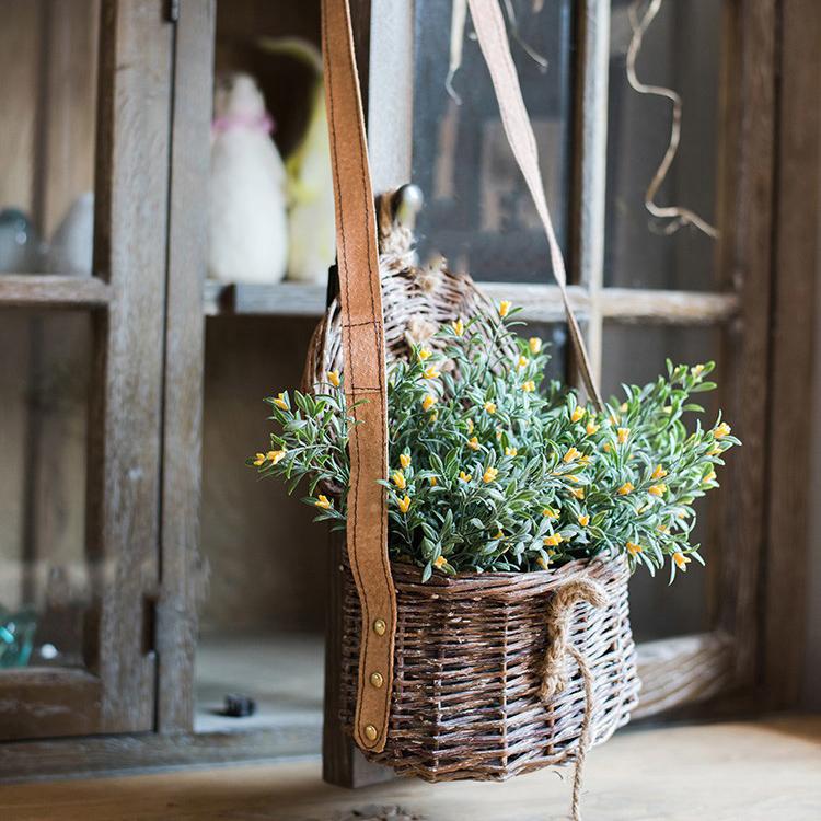 Silk artificial orchid stem set in yellow, 13 inches tall, in a woven wicker hanging basket on Tampa Home & Garden Store