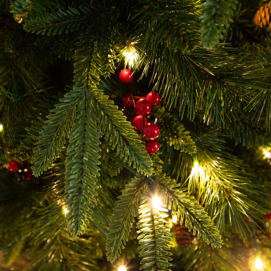 Nearly Natural pre-lit Christmas greenery close-up: pine needles, warm white lights, red berries on Tampa Home & Garden Store