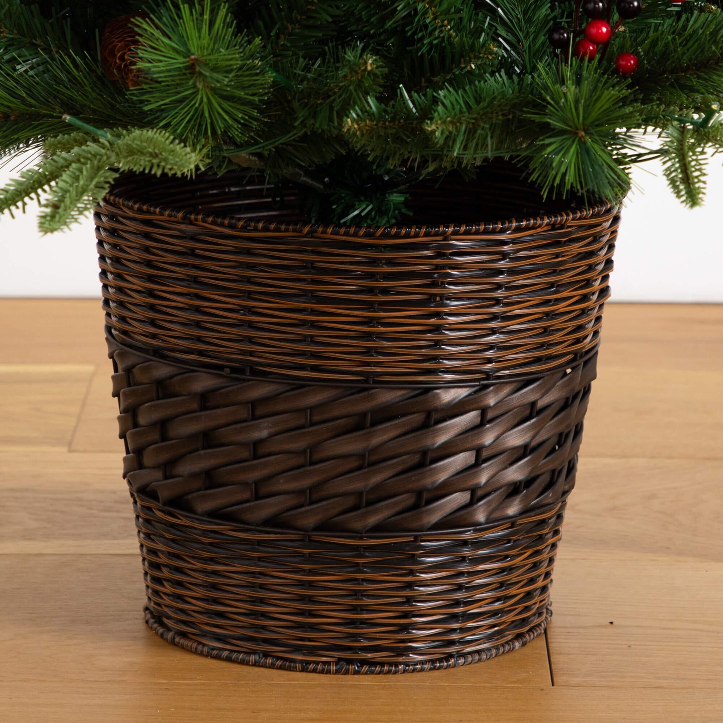 Nearly Natural artificial greenery in a dark wicker basket with pinecones and berries on Tampa Home & Garden Store