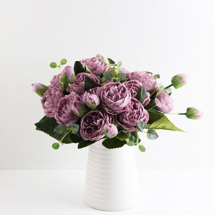 Artificial rose bouquet with pink-purple silk peonies and green foliage in a ribbed vase on Tampa Home & Garden Store