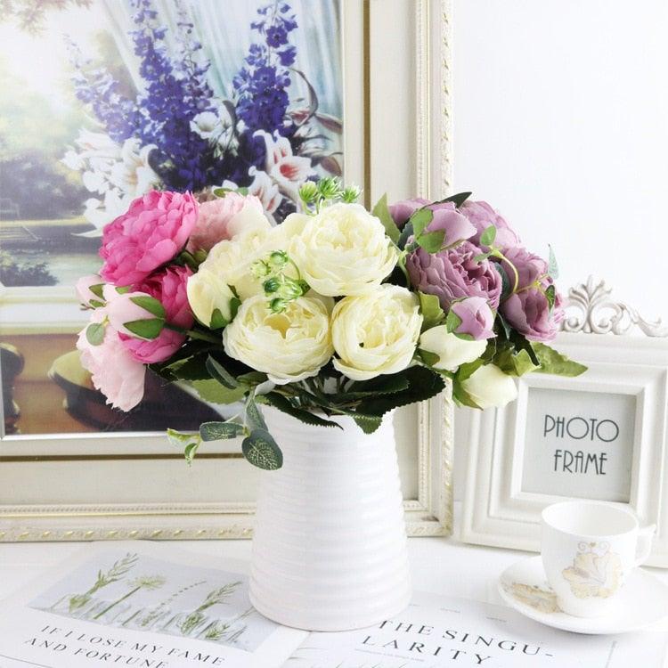 Stevvex artificial rose bouquet in a white ribbed vase with pink cream and purple silk blooms on Tampa Home & Garden Store