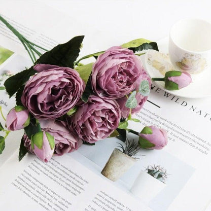 Artificial rose bouquet with lavender purple silk peony-style blooms and green leaves on Tampa Home & Garden Store