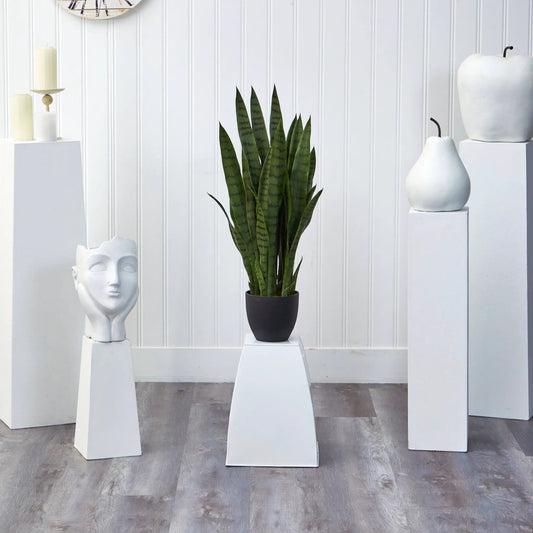Sansevieria artificial plant in a black planter on a white pedestal on Tampa Home & Garden Store