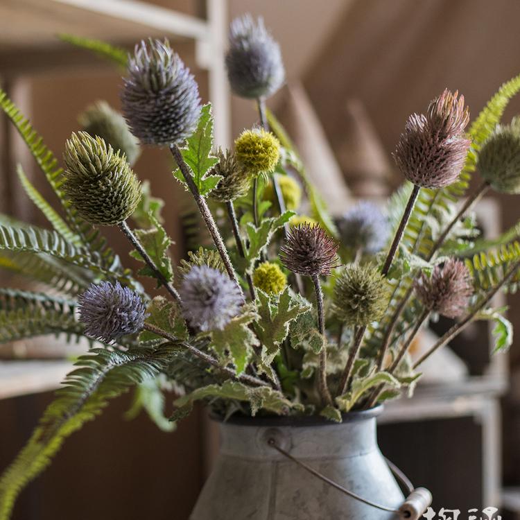 Faux silk thistle flower stem bouquet in mixed purple and olive-green hues in a metal vase on Tampa Home & Garden Store