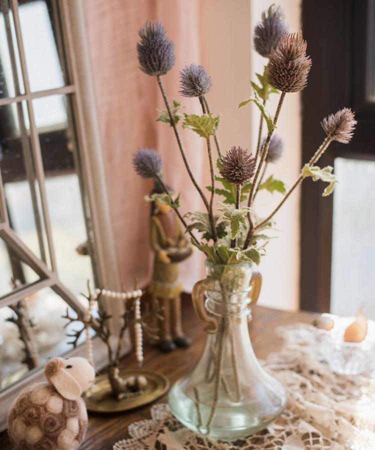 Faux Silk Thistle Flower Stem set of 7 tall heads in a clear glass vase on a table on Tampa Home & Garden Store