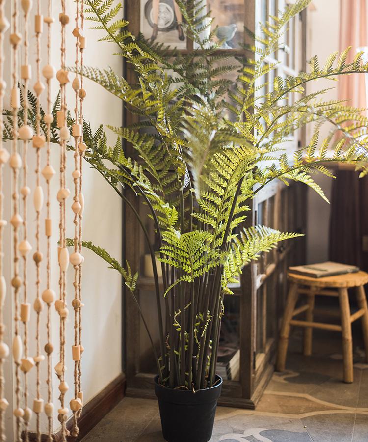 Artificial Faux Cyathea Tree In Pot with lush green fern fronds in a black planter indoors on Tampa Home & Garden Store