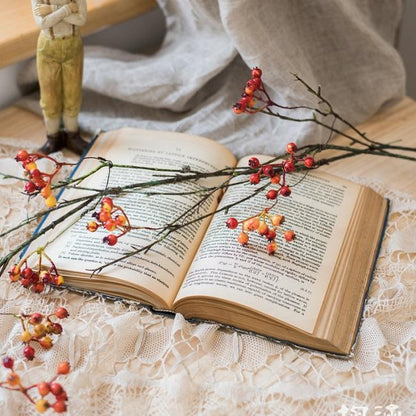 Orange Faux Berry Vine 39in long RusticReach; red-orange berries on brown stems over book on Tampa Home & Garden Store