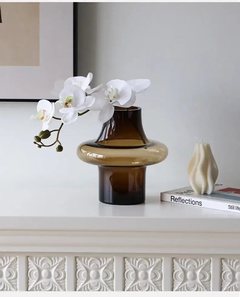 Amber glass bulbous vase by Decorbites with white orchid stems, modern tabletop display on Tampa Home & Garden Store