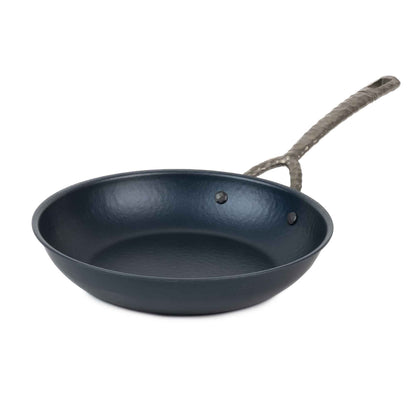 Carbon steel frying pan by Alva Cookware with a rope-wrapped handle and dark seasoned interior on Tampa Home & Garden Store