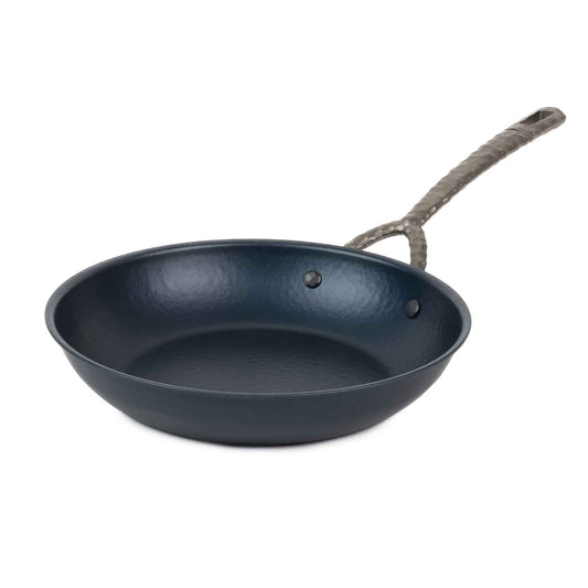 Carbon steel frying pan by Alva Cookware with a rope-wrapped handle and dark seasoned interior on Tampa Home & Garden Store