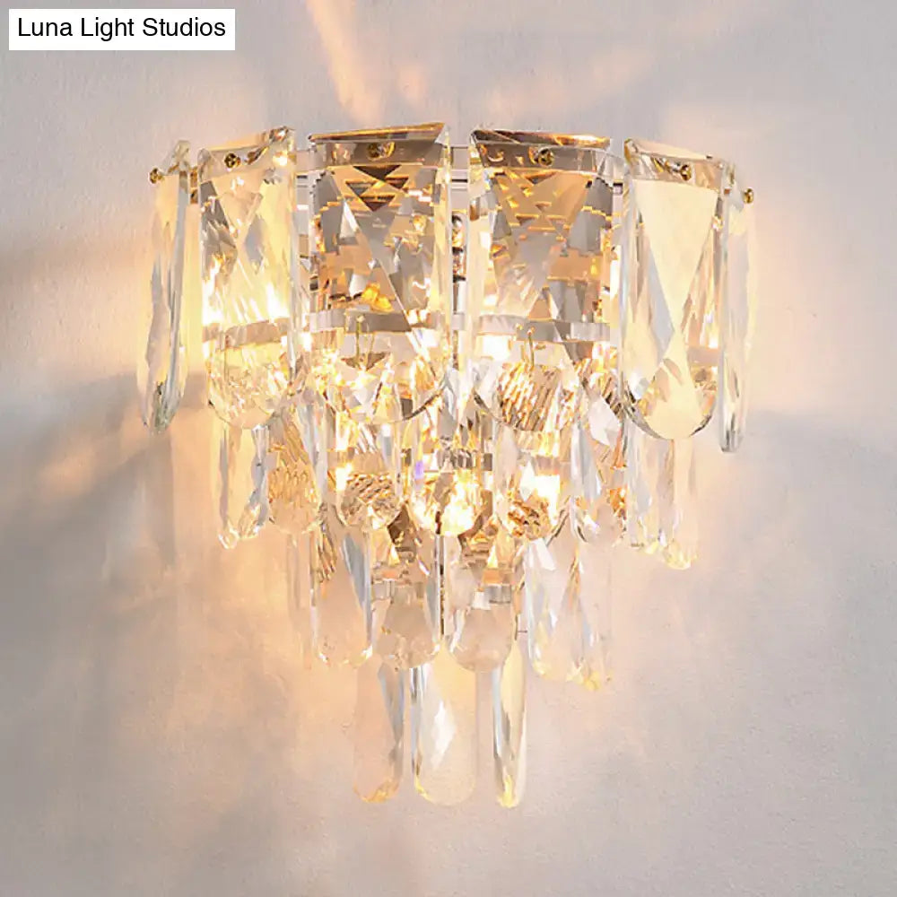 Gold crystal tiered lamp with hanging prisms and warm glow on Tampa Home & Garden Store