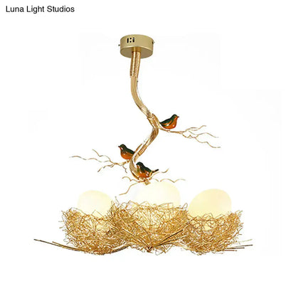 Artistry milk white glass bird nest chandelier pendant with gold twig nest and two birds on Tampa Home & Garden Store