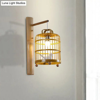 Decorbites wood cage design wall sconce lamp in warm gold finish with bird figure on Tampa Home & Garden Store