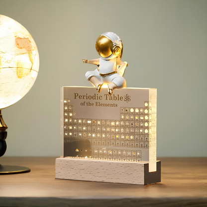 LED Periodic Table Element Display by Moktan Sabai with gold astronaut atop element grid plaque on Tampa Home & Garden Store
