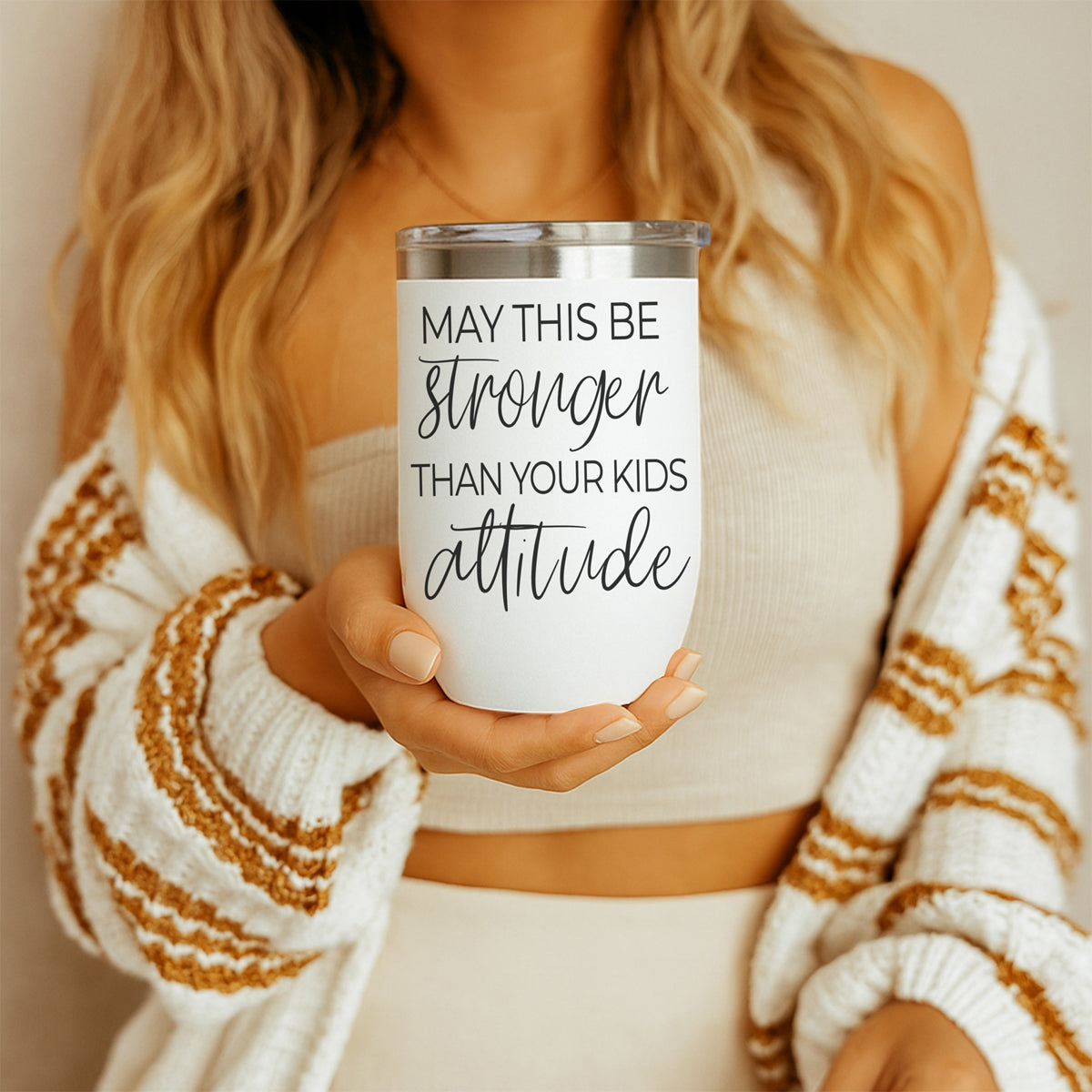 Kids Attitude 17oz tumbler white with black script text, held by a woman in a beige top on Tampa Home & Garden Store