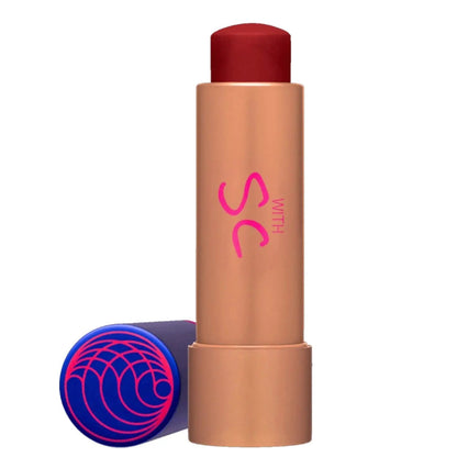 Tinted Lip Balm Nava Beauty in bronze tube with red cap and purple cap featuring pink swirl on Tampa Home & Garden Store