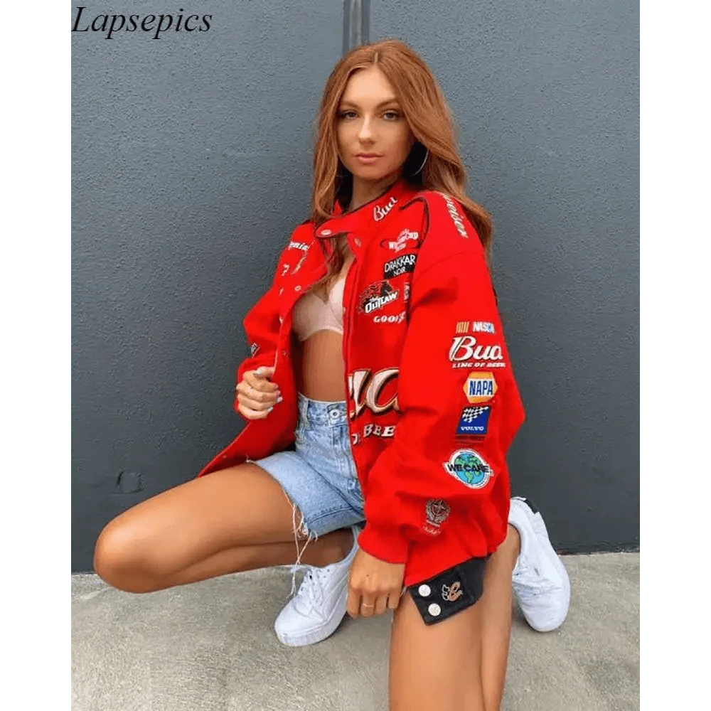 Stevvex red printed oversized jacket with patch logos worn over a beige top and denim shorts on Tampa Home & Garden Store