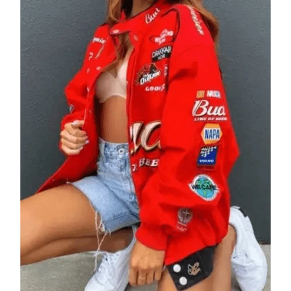 Stevvex red printed oversized coat jacket with patch logos, worn by woman in denim shorts on Tampa Home & Garden Store