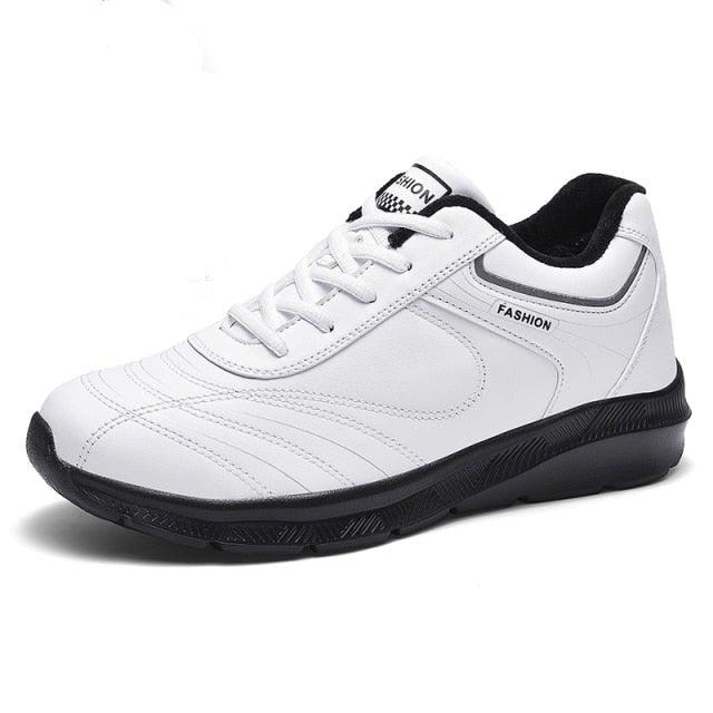 Stevvex white leather sneakers, lace-up, black outsole with fashion label accents on Tampa Home & Garden Store