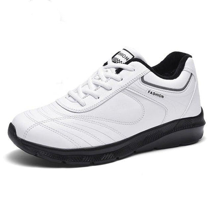 Stevvex white leather sneakers, lace-up, black outsole with fashion label accents on Tampa Home & Garden Store