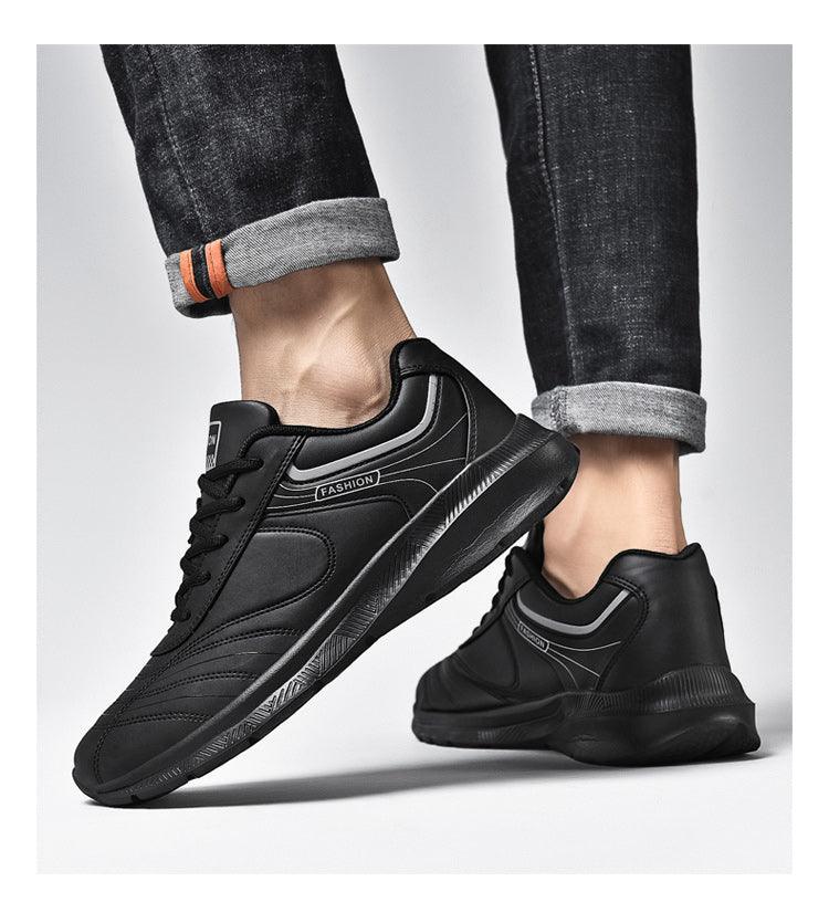 Stevvex pair of black leather sneakers with gray trim, lace-up casual athletic shoes on Tampa Home & Garden Store