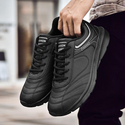 Stevvex pair of black leather sneakers with stitched panels, lace-up, fashion athletic sneakers on Tampa Home & Garden Store