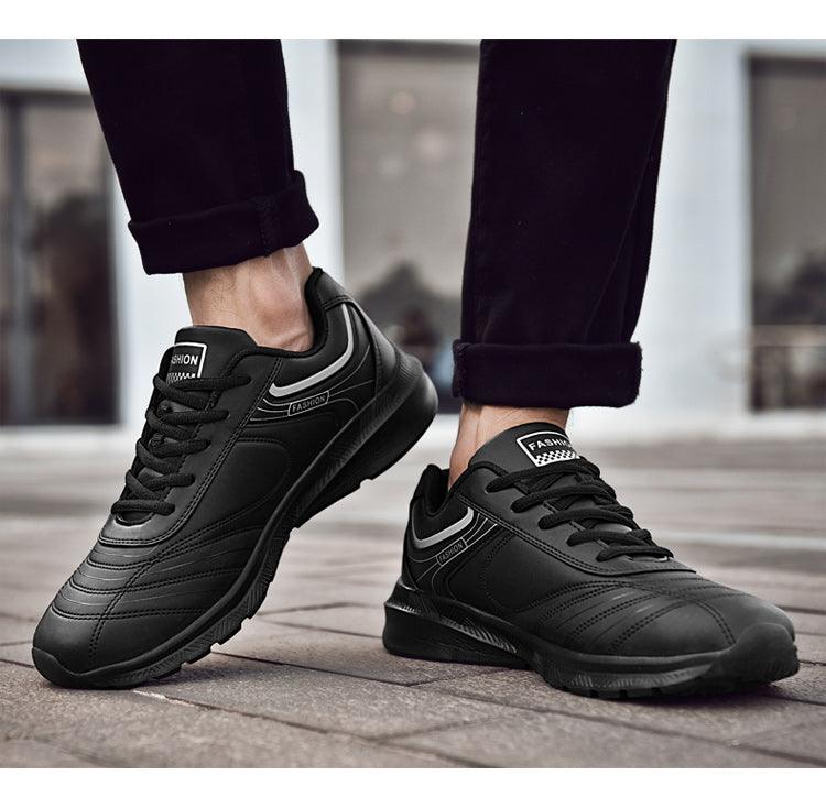 Stevvex black leather sneakers, pair of lace-up athletic casual shoes with stitched panels on Tampa Home & Garden Store