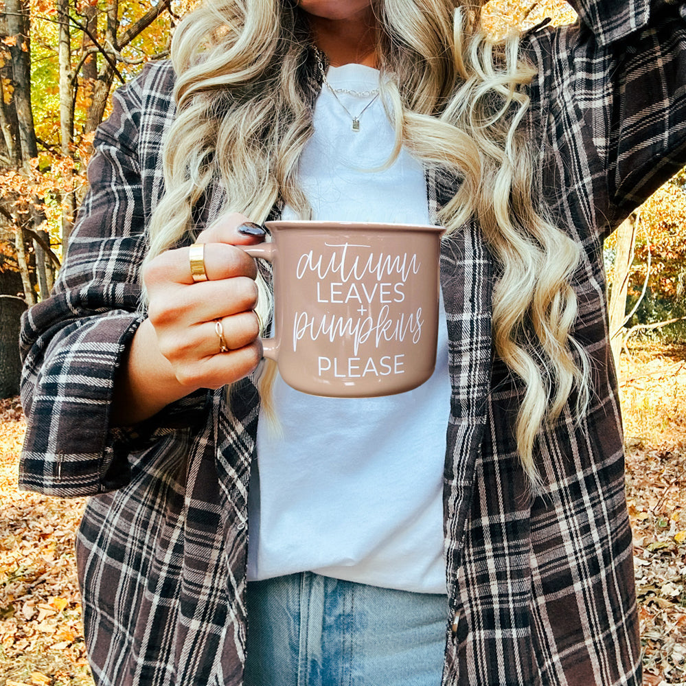 Gia Roma Autumn Leaves coffee mug, dusty rose ceramic with white script, outdoors in fall on Tampa Home & Garden Store