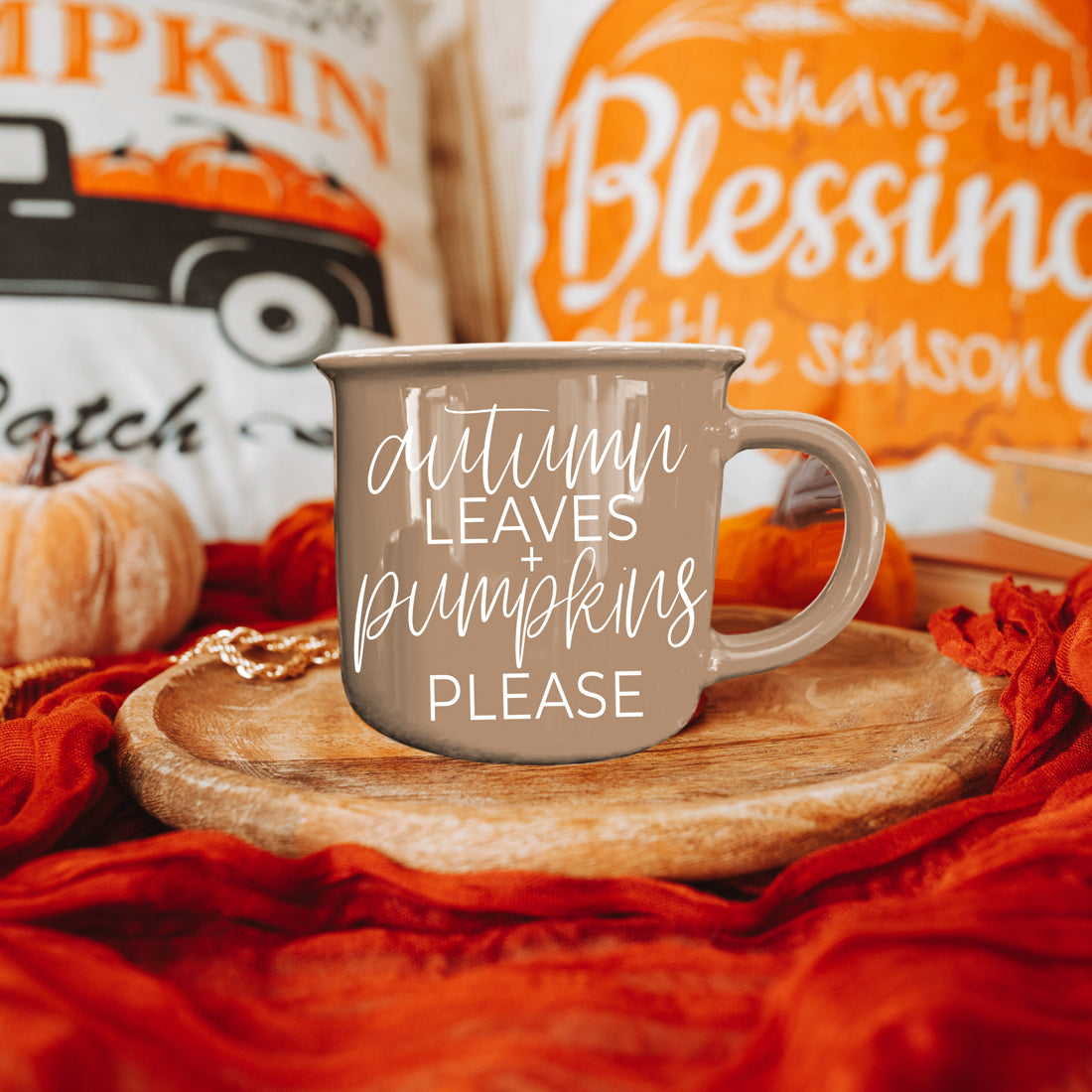 Autumn Leaves coffee mug in taupe ceramic with white script on a wooden tray, pumpkins on Tampa Home & Garden Store