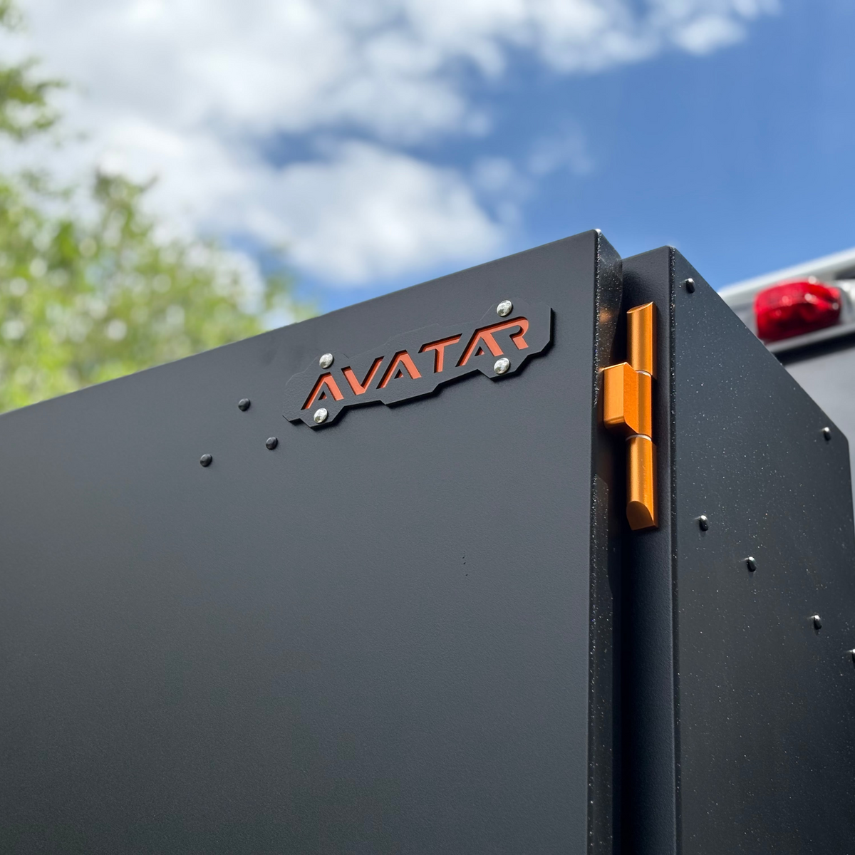 Avatar Caddie Storage Box avatar offroad gray metal panel with orange latch and visible screws on Tampa Home & Garden Store