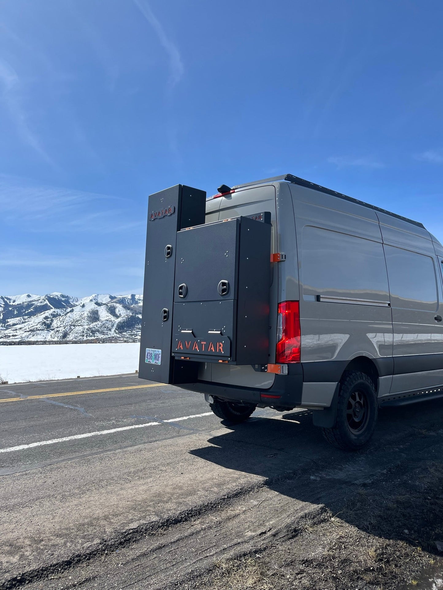The Ultra Rack low profile roof rack on a Sprinter van with black metal panels and Avatar Offroad branding on Tampa Home & Garden Store