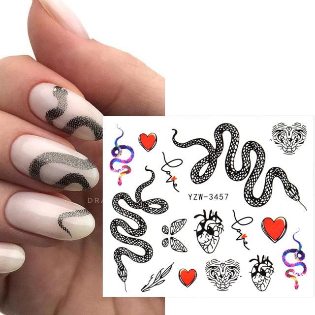 Nail art transfer stickers sheet with black snake decals and red hearts on nude nails on Tampa Home & Garden Store
