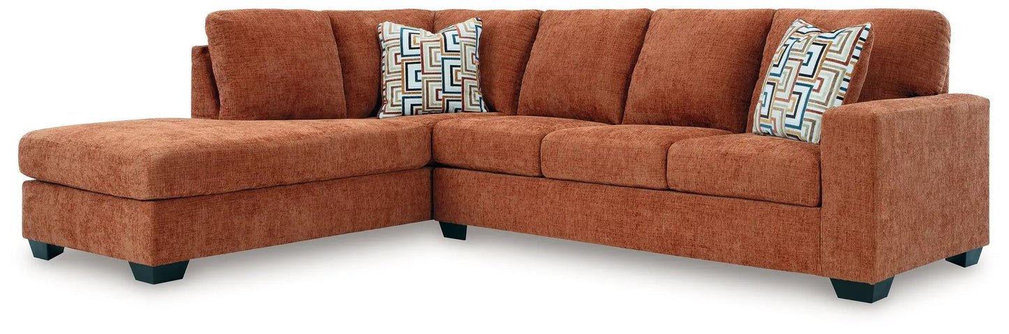 Aviemore stationary sectional in rust-orange upholstery with two geometric accent pillows on Tampa Home & Garden Store