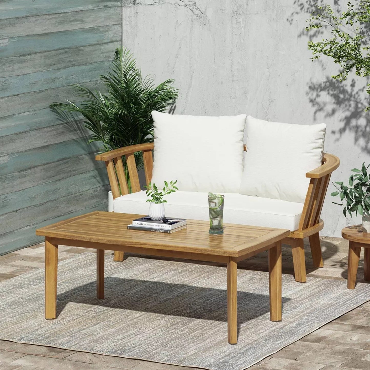 2-person outdoor acacia wood patio seating group with cushions and coffee table on Tampa Home & Garden Store