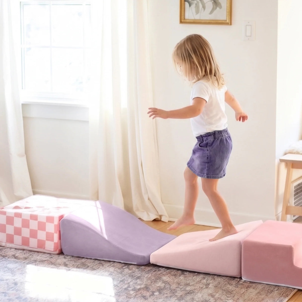 Tiny Land PlayNest Climbing Blocks Violet modular play mats with a child stepping across on Tampa Home & Garden Store
