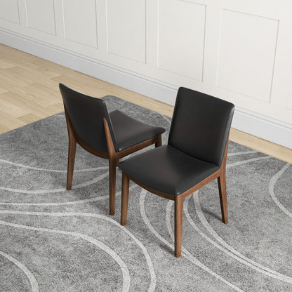Mid-Century Modern two-chair set with black leather upholstery and wood legs HouseOfZazla on Tampa Home & Garden Store