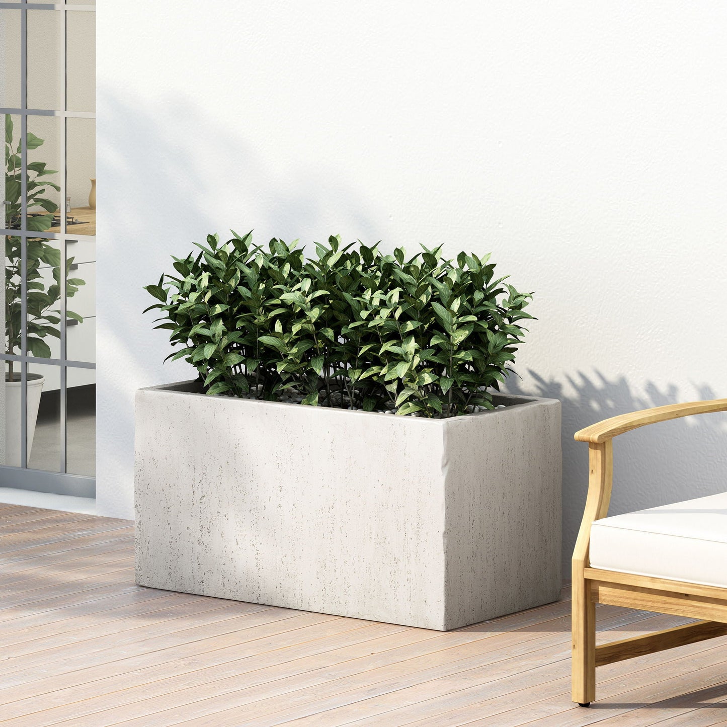 Modern Outdoor Planter by HouseOfZazla in gray concrete with lush green shrubs on a patio on Tampa Home & Garden Store