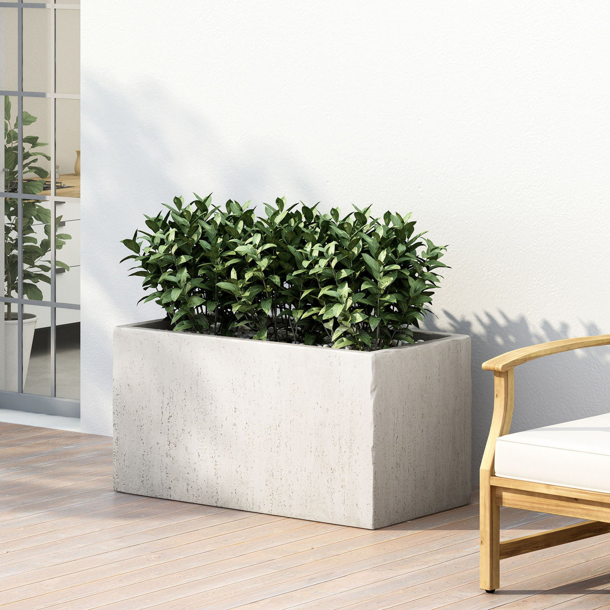 Modern Outdoor Planter by HouseOfZazla in gray concrete with lush green shrubs on a patio on Tampa Home & Garden Store