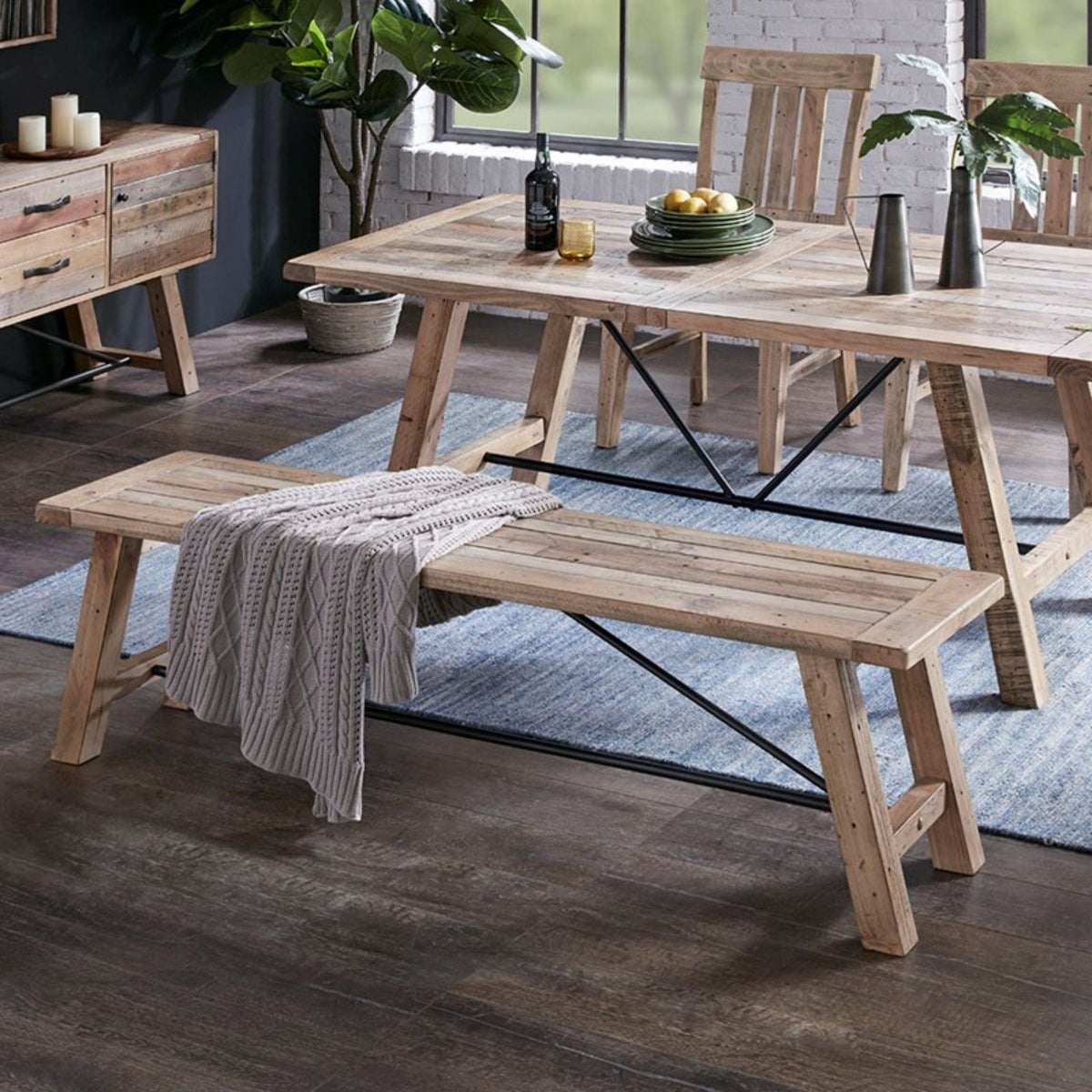 Solid wood dining bench with metal stretchers in light brown for a rustic dining setting on Tampa Home & Garden Store