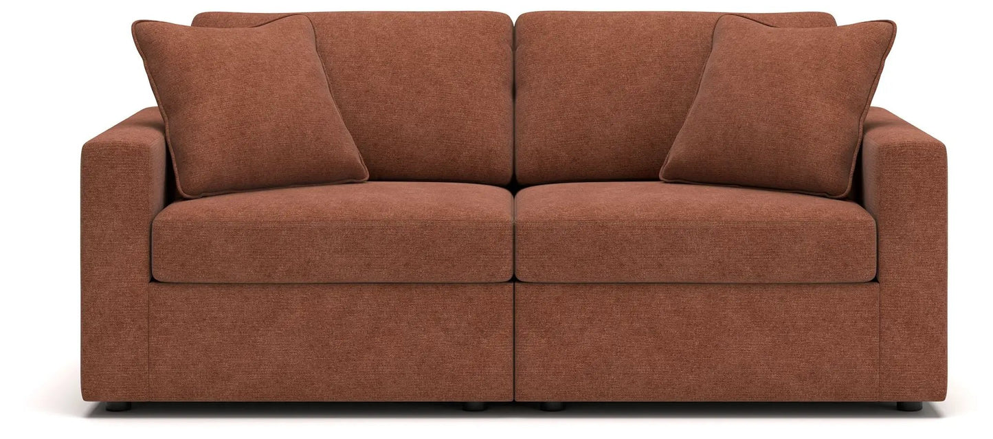 Modmax Spice sectional sofa in rust-orange textured fabric with two pillows on Tampa Home & Garden Store