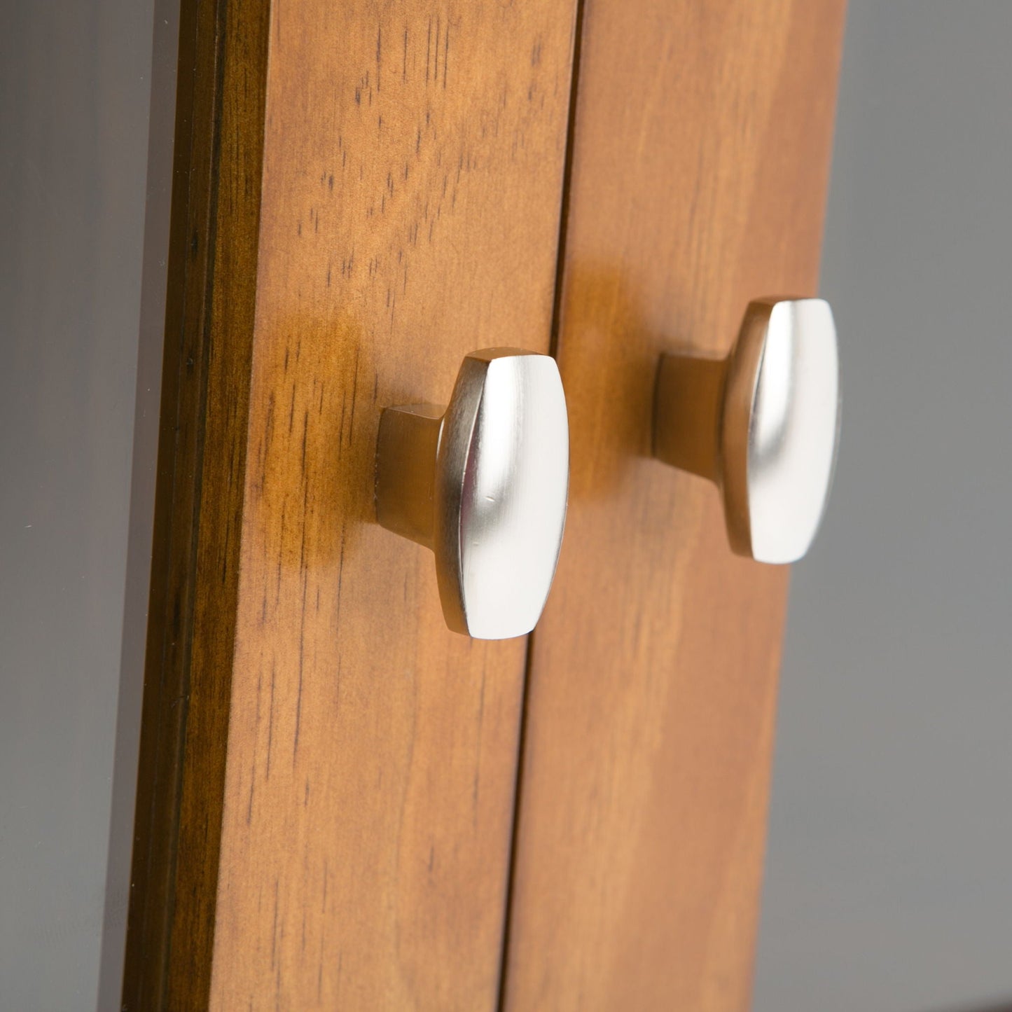 Warm Shaker handcrafted low storage cabinet in warm wood with silver curved handles on Tampa Home & Garden Store