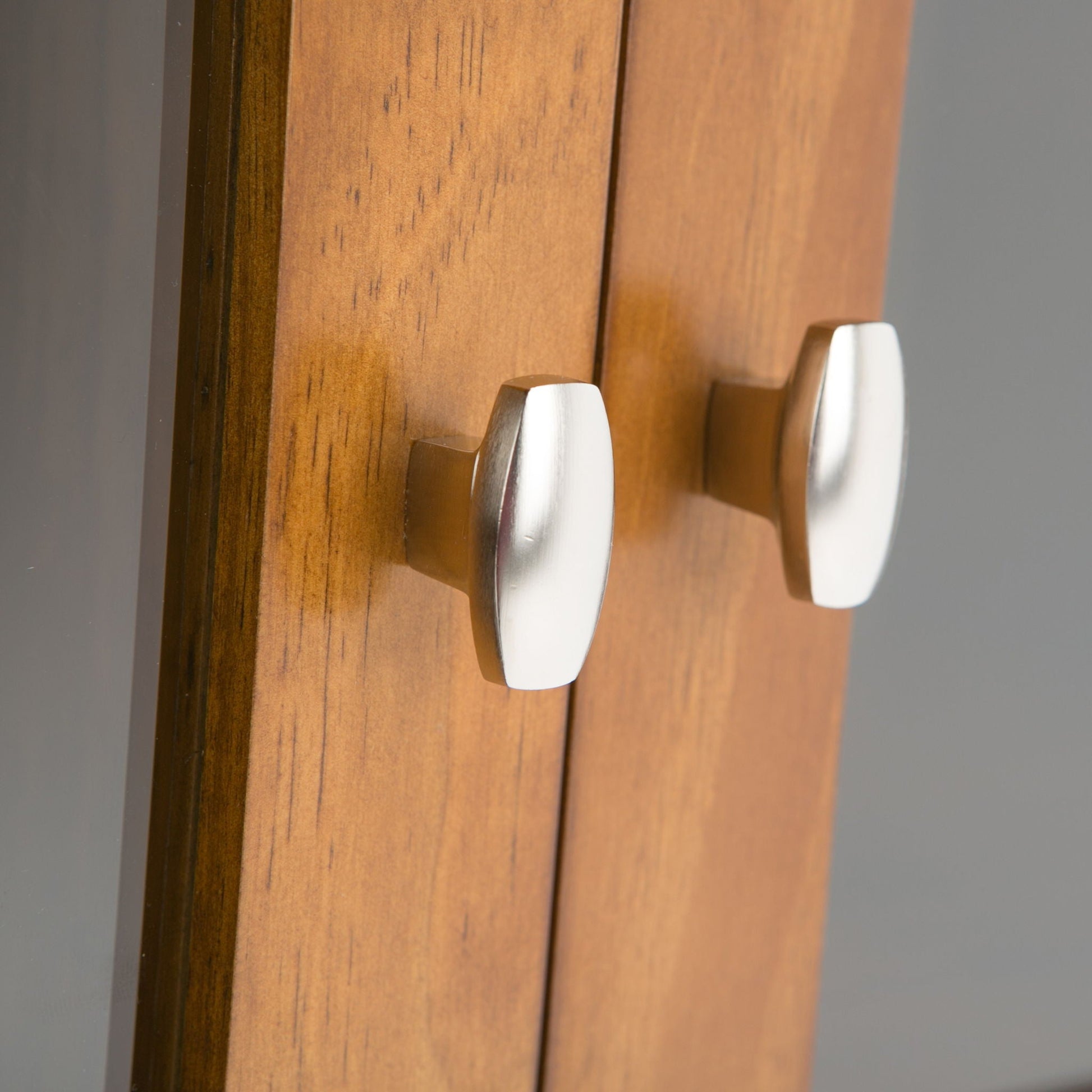 Warm Shaker handcrafted low storage cabinet in warm wood with silver curved handles on Tampa Home & Garden Store