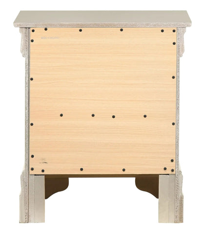 Traditional nightstand with beige top and distressed silver frame over light wood panels on Tampa Home & Garden Store